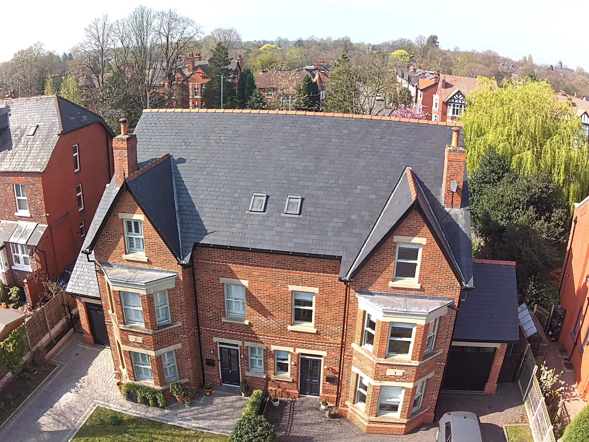 Aerial view of a large slate re-roof on a period property
